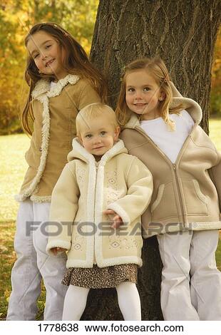 A group of three girls View Large Photo Image Stock Photo - A group of three girls. Fotosearch