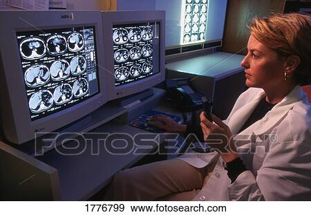 A lab technician checks samples View Large Photo Image Stock Photo - A lab technician checks samples. Fotosearch