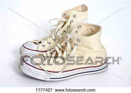 A pair of cream hightop sneakers View Large Photo Image Stock Photo - A pair of cream hightop sneakers. Fotosearch