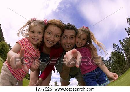 A portrait of a family outside View Large Photo Image Stock Photography - A portrait of a family outside. Fotosearch