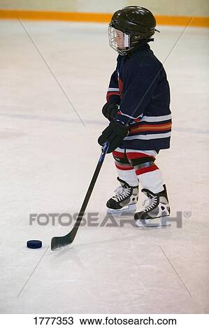 A portrait of a young hockey player View Large Photo Image Stock Image - A portrait of a young hockey player. Fotosearch