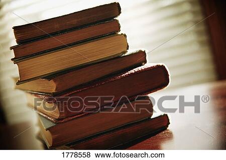 Stock Photo - A stack of worn books. Fotosearch
