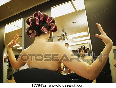 A surprised young woman getting her hair styled. View Large Photo Image Stock Image - A surprised young woman getting her hair styled.. Fotosearch