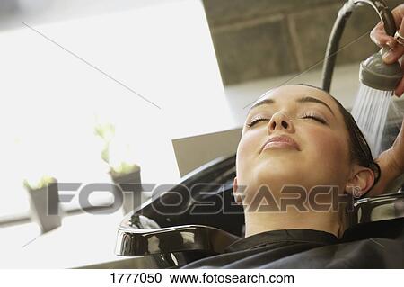 A woman getting her hair washed View Large Photo Image Stock Image - A woman getting her hair washed. Fotosearch