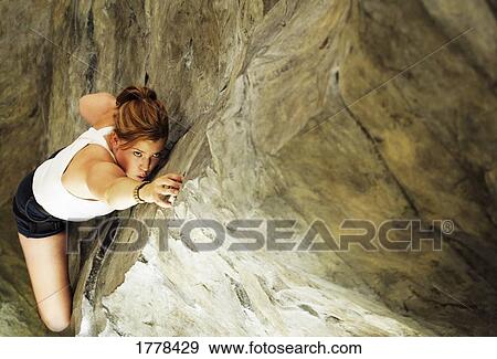 A woman rock climbing View Large Photo Image Stock Photo - A woman rock climbing. Fotosearch