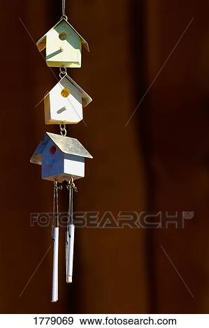 Stock Photo - Bird house wind chimes. Fotosearch
