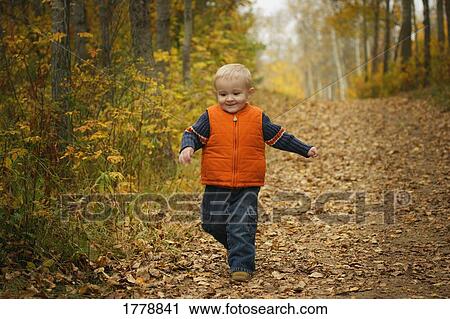Boy goes for a walk View Large Photo Image Stock Image - Boy goes for a walk. Fotosearch