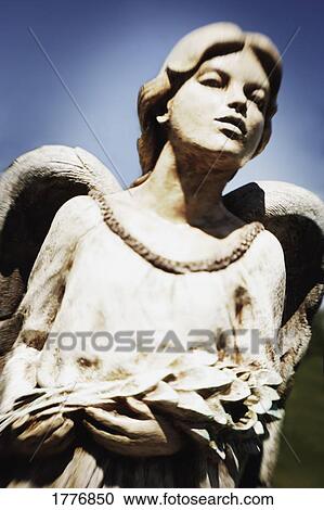 Stock Image - Carved statue of an angel. Fotosearch