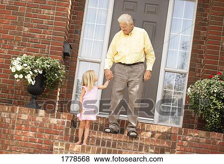 Stock Photo - Child holds senior's hand. Fotosearch