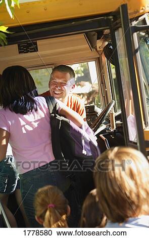 Children board a school bus View Large Photo Image Stock Image - Children board a school bus. Fotosearch