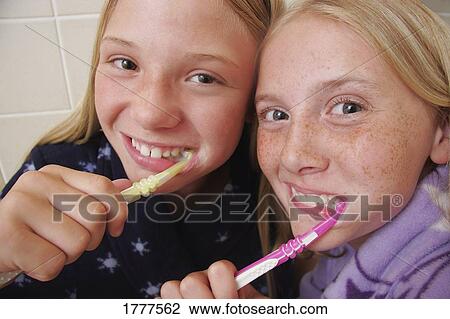 Cleaning our teeth View Large Photo Image Stock Image - Cleaning our teeth. Fotosearch