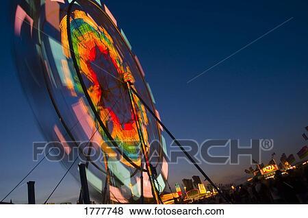 Close up of a Ferris wheel at night View Large Photo Image Stock Photo - Close up of a Ferris wheel at night. Fotosearch