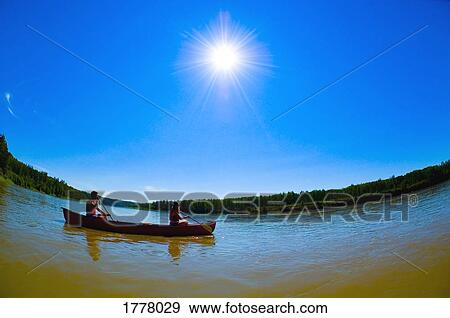 Stock Photo - Couple canoeing. Fotosearch