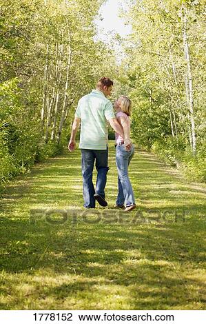Stock Image - Couple go for a walk. Fotosearch