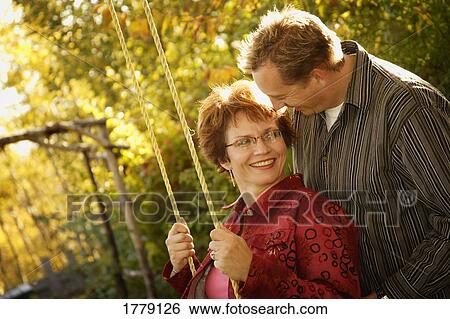 Stock Photograph - Couple playing together. Fotosearch