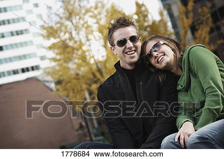 Couple with trendy sunglasses View Large Photo Image Picture - Couple with trendy sunglasses. Fotosearch