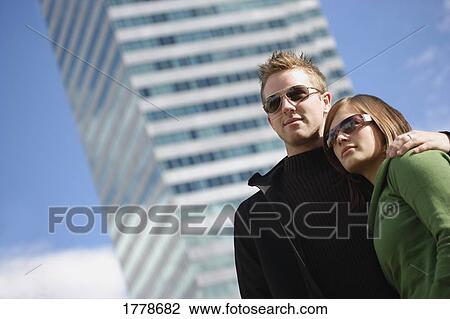 Couple with trendy sunglasses View Large Photo Image Stock Image - Couple with trendy sunglasses. Fotosearch