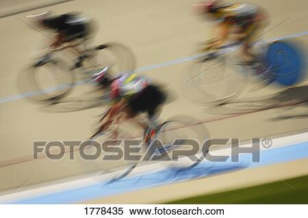 Cyclists racing on a track View Large Photo Image Stock Photography - Cyclists racing on a track. Fotosearch
