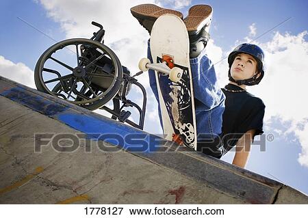 Determined child with skateboard View Large Photo Image Stock Photo - Determined child with skateboard. Fotosearch