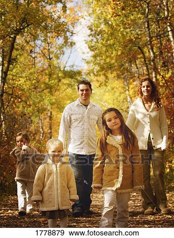 Family walking on path View Large Photo Image Stock Photo - Family walking on path. Fotosearch