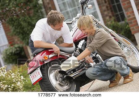 Stock Photo - Father and son laugh together. Fotosearch