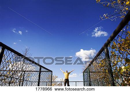 Stock Photograph - Finding freedom within the boundaries. Fotosearch