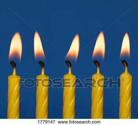 Stock Photo - Five candles burning. Fotosearch