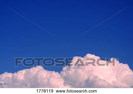 Stock Photo - Fluffy pink and white clouds. Fotosearch
