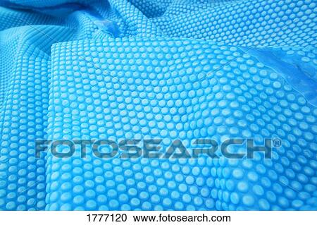 Folds of blue textured fabric View Large Photo Image Stock Image - Folds of blue textured fabric. Fotosearch