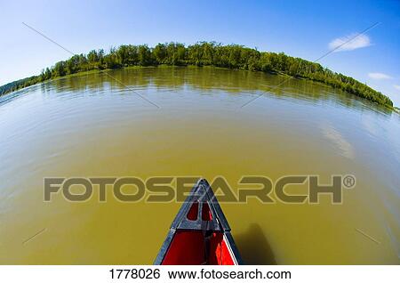 Stock Photograph - Front of canoe on water. Fotosearch