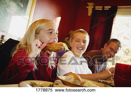 Girl devours turkey leg View Large Photo Image Stock Photography - Girl devours turkey leg. Fotosearch