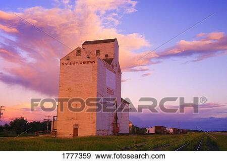 Grain elevator next to railway tracks View Large Photo Image Stock Photo - Grain elevator next to railway tracks. Fotosearch