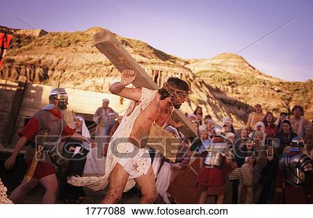 Jesus carrying the cross View Large Photo Image Stock Photo - Jesus carrying the cross. Fotosearch