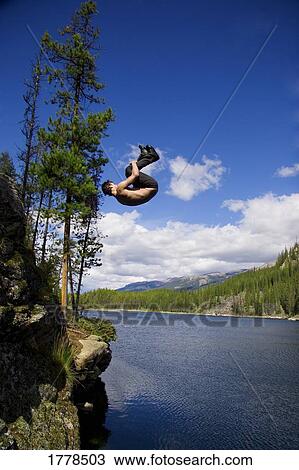 Jumping off a cliff View Large Photo Image Stock Image - Jumping off a cliff. Fotosearch