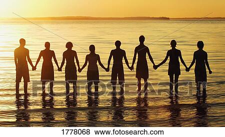 Stock Photo - Line of men in water. Fotosearch