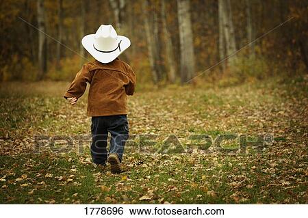 Stock Photograph - Little cowboy. Fotosearch