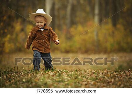 Little cowboy View Large Photo Image Stock Photography - Little cowboy. Fotosearch
