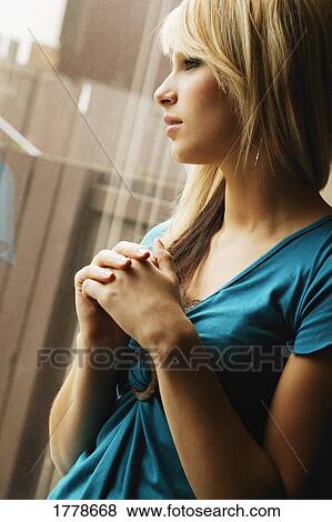Looking out the window View Large Photo Image Stock Photo - Looking out the window. Fotosearch