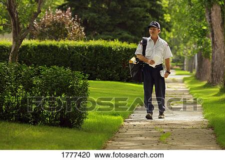 Mailman delivering mail View Large Photo Image Stock Image - Mailman delivering mail. Fotosearch