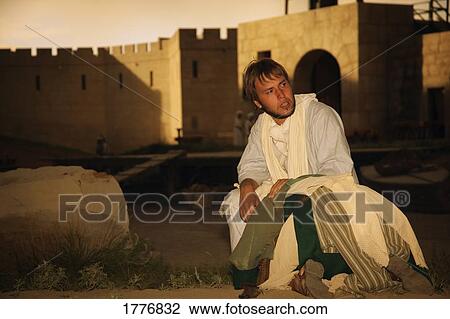 Stock Image - Man comforting person. Fotosearch