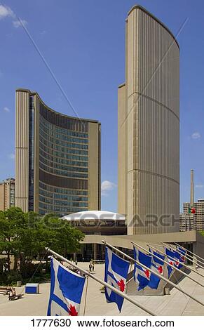 Stock Image - Modern public buildings and Canadian flags. Fotosearch