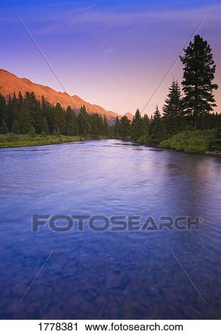 Stock Image - Mountain Sunset on the Elk River. Fotosearch
