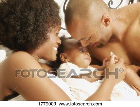 Parents with baby View Large Photo Image Stock Photo - Parents with baby. Fotosearch