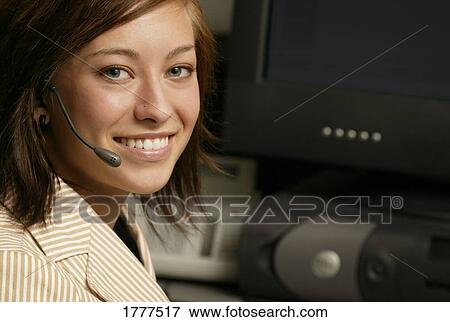 Stock Photo - Portrait of a businesswoman at her desk. Fotosearch
