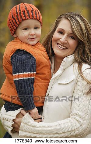Stock Image - Portrait of a mother and child. Fotosearch