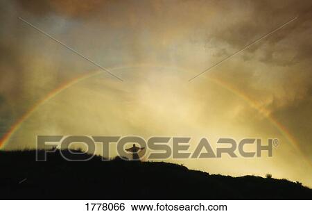 Rainbow over angel on hill View Large Photo Image Stock Photograph - Rainbow over angel on hill. Fotosearch