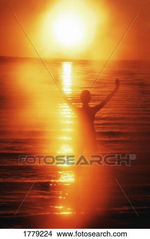 Picture - Raising hands towards heaven. Fotosearch