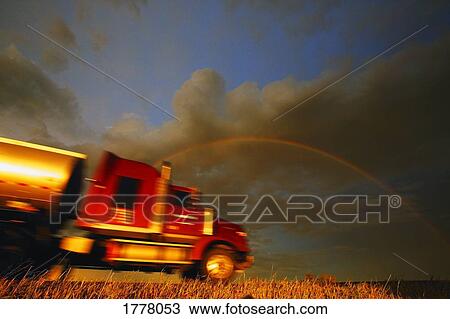 Semi truck moving on road View Large Photo Image Stock Image - Semi truck moving on road. Fotosearch