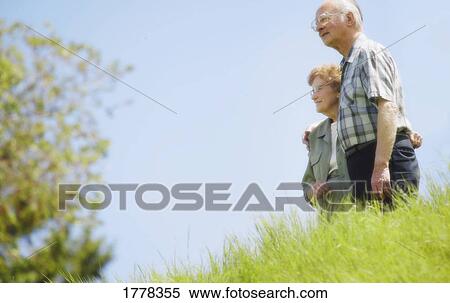 Senior couple in field View Large Photo Image Stock Photography - Senior couple in field. Fotosearch