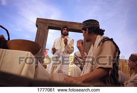 Stock Image - Sharing bread. Fotosearch
